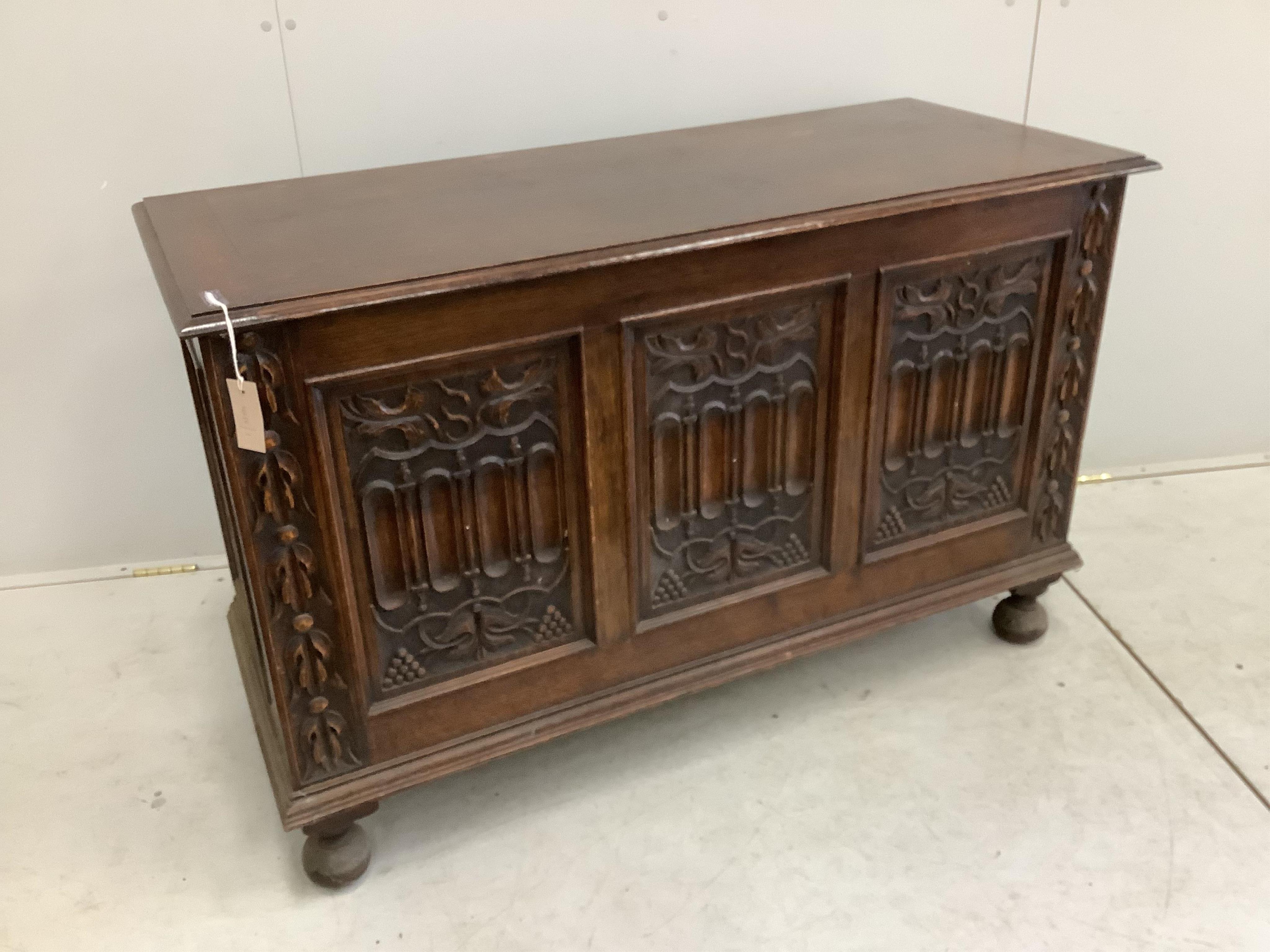 A 17th century style carved oak coffer, width 121cm, depth 52cm, height 76cm. Condition - fair